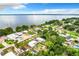 Aerial view of waterfront community with numerous houses at 34035 Linda Ln, Leesburg, FL 34788