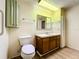 Clean bathroom with wood vanity and mirror at 34035 Linda Ln, Leesburg, FL 34788