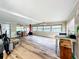 Open living area with wood floors and a red fireplace at 34035 Linda Ln, Leesburg, FL 34788