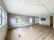 Open concept living area with light walls and vinyl flooring at 34035 Linda Ln, Leesburg, FL 34788
