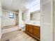 Clean bathroom with a tub, toilet, and vanity at 34035 Linda Ln, Leesburg, FL 34788
