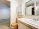 Bathroom with toilet, vanity, and access to bedroom at 34035 Linda Ln, Leesburg, FL 34788