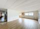Bright living room with new flooring and access to kitchen at 34035 Linda Ln, Leesburg, FL 34788