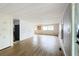 Open living area with light wood flooring and neutral walls at 34035 Linda Ln, Leesburg, FL 34788