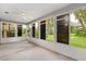 Spacious sunroom with multiple windows and backyard view at 131 Costa Mesa Dr, The Villages, FL 32159