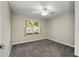 Bedroom with window, carpet, and ceiling fan at 131 Costa Mesa Dr, The Villages, FL 32159