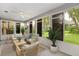 Sunroom with furnished seating and backyard view at 131 Costa Mesa Dr, The Villages, FL 32159