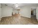 Living room with wood-look floors and neutral walls at 131 Costa Mesa Dr, The Villages, FL 32159