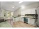 Eat-in kitchen with stainless steel appliances and green countertops at 131 Costa Mesa Dr, The Villages, FL 32159