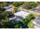 House with a screened-in pool and lush landscaping at 6919 Fern Cir, Leesburg, FL 34748