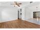 Spacious living room featuring hardwood floors and ceiling fan at 6919 Fern Cir, Leesburg, FL 34748