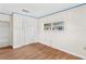 Simple bedroom with wood floors and built-in closet at 6919 Fern Cir, Leesburg, FL 34748