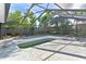 Inground pool with screen enclosure needs some TLC at 6919 Fern Cir, Leesburg, FL 34748