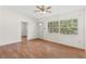 Bright living area with hardwood floors and large window at 6919 Fern Cir, Leesburg, FL 34748