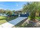 Blue house exterior with landscaping and driveway at 6919 Fern Cir, Leesburg, FL 34748