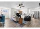 Bright living room with comfy sofas and built-in kitchen counter at 37102 Oak Ln, Umatilla, FL 32784