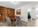 Dining room with a built-in wooden shelving and six gray chairs at 37102 Oak Ln, Umatilla, FL 32784