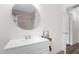 Clean bathroom with white vanity and large mirror at 37102 Oak Ln, Umatilla, FL 32784