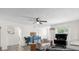 Living room with light walls, hardwood floors, and comfortable seating at 37102 Oak Ln, Umatilla, FL 32784