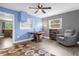 Home office with built-in shelving and hardwood floors at 37102 Oak Ln, Umatilla, FL 32784