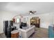 Living room features hardwood floors, light walls and comfortable seating at 37102 Oak Ln, Umatilla, FL 32784