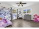 bedroom with playful decor and hardwood floors at 37102 Oak Ln, Umatilla, FL 32784