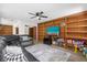 Living room features built-in shelving and hardwood floors at 37102 Oak Ln, Umatilla, FL 32784
