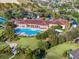 Resort-style pool, tennis courts, and clubhouse in a luxury community at 3603 Solana Cir # B, Clermont, FL 34711