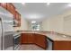 Spacious kitchen with stainless steel appliances and ample cabinetry at 3603 Solana Cir # B, Clermont, FL 34711