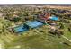 Aerial view of tennis courts, shuffleboard, and bocce ball courts at 3603 Solana Cir # B, Clermont, FL 34711