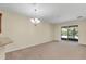 Bright dining room with sliding glass doors leading to a patio at 3603 Solana Cir # B, Clermont, FL 34711
