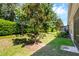 Landscaped backyard with lush greenery and privacy at 3603 Solana Cir # B, Clermont, FL 34711