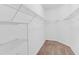 Spacious walk-in closet with wire shelving and ample storage at 3603 Solana Cir # B, Clermont, FL 34711
