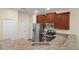 Modern kitchen with wood cabinets and granite countertops at 3603 Solana Cir # B, Clermont, FL 34711