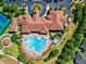 Community clubhouse with pool and tennis courts at 3603 Solana Cir # B, Clermont, FL 34711