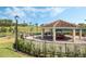 Relaxing covered gazebo with tables and chairs near tennis courts at 3603 Solana Cir # B, Clermont, FL 34711