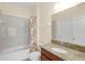 Clean bathroom with granite countertop, single vanity, and shower/tub combo at 3603 Solana Cir # B, Clermont, FL 34711