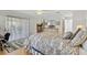 Main bedroom with a dresser and access to backyard patio at 8084 Se 175Th Malmaison St, The Villages, FL 32162