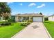 Charming single story home with landscaped yard and driveway at 8084 Se 175Th Malmaison St, The Villages, FL 32162