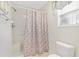 Clean bathroom with shower stall and geometric patterned curtain at 8084 Se 175Th Malmaison St, The Villages, FL 32162