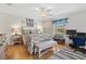 Spacious bedroom with wood floors and a view of the backyard at 8084 Se 175Th Malmaison St, The Villages, FL 32162