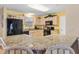 Bright kitchen with granite countertops and black appliances at 8084 Se 175Th Malmaison St, The Villages, FL 32162