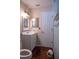 Bathroom with white vanity, toilet and tile floor at 14700 Se 94Th Ave, Summerfield, FL 34491