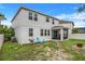 Large backyard with screened porch and fire pit area at 1103 White Water Bay Dr, Groveland, FL 34736