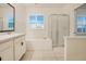 Bathroom with soaking tub and separate shower at 1103 White Water Bay Dr, Groveland, FL 34736