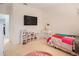 Bedroom with a twin bed, plenty of storage, and a TV at 1103 White Water Bay Dr, Groveland, FL 34736