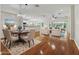 Bright dining room with hardwood floors and seating for six at 9056 Se 120Th Loop, Summerfield, FL 34491