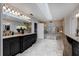 Elegant bathroom with double vanity and walk-in shower at 6779 Clayton St, Mount Dora, FL 32757