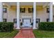 Grand entrance with white columns and double doors at 6779 Clayton St, Mount Dora, FL 32757