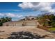 Four-car garage with ample space and a long driveway at 6779 Clayton St, Mount Dora, FL 32757